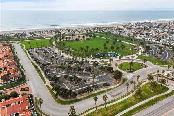 an aerial view of residential building and ocean