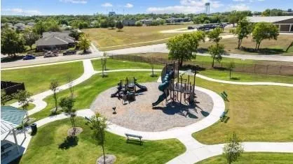 a view of a palm trees front of house