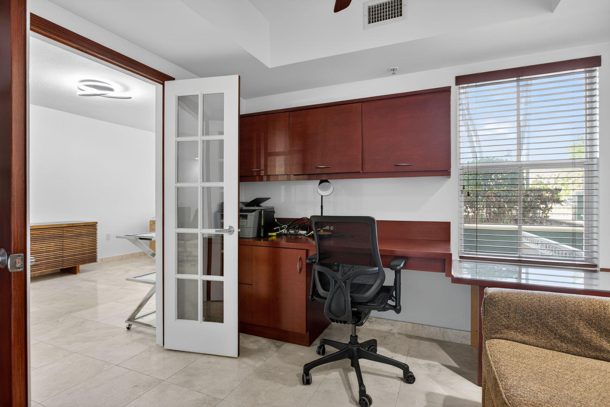 2051 Southeast 3rd Street, Unit TH8 Deerfield Beach, FL 33441 - Photo 11 of 58 a view of a workspace with furniture and a window