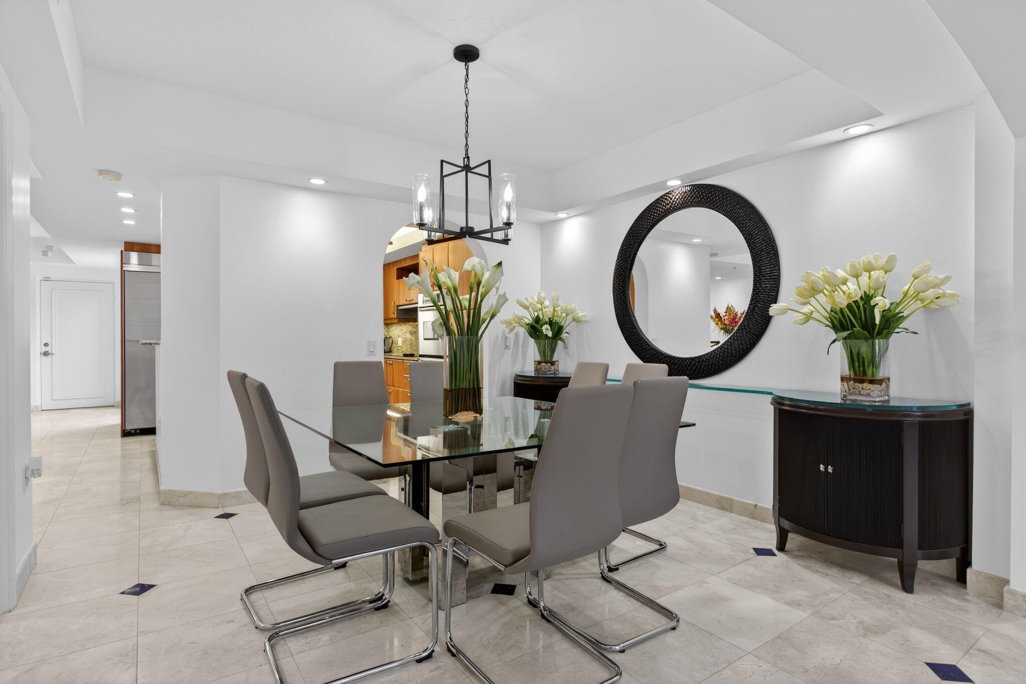 2051 Southeast 3rd Street, Unit TH8 Deerfield Beach, FL 33441 - Photo 12 of 58 a living room with furniture a mirror and a chandelier