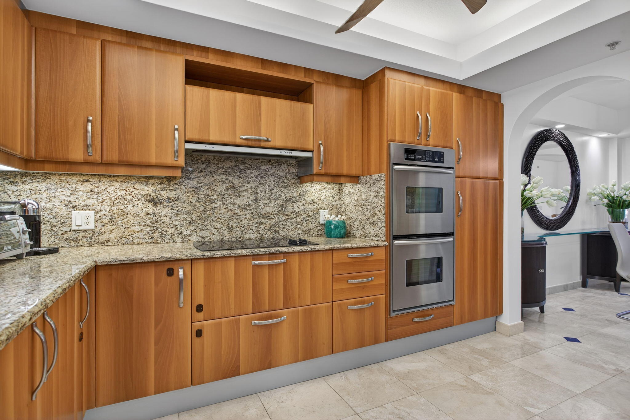 2051 Southeast 3rd Street, Unit TH8 Deerfield Beach, FL 33441 - Photo 19 of 58 a kitchen with stainless steel appliances granite countertop a refrigerator sink and cabinets