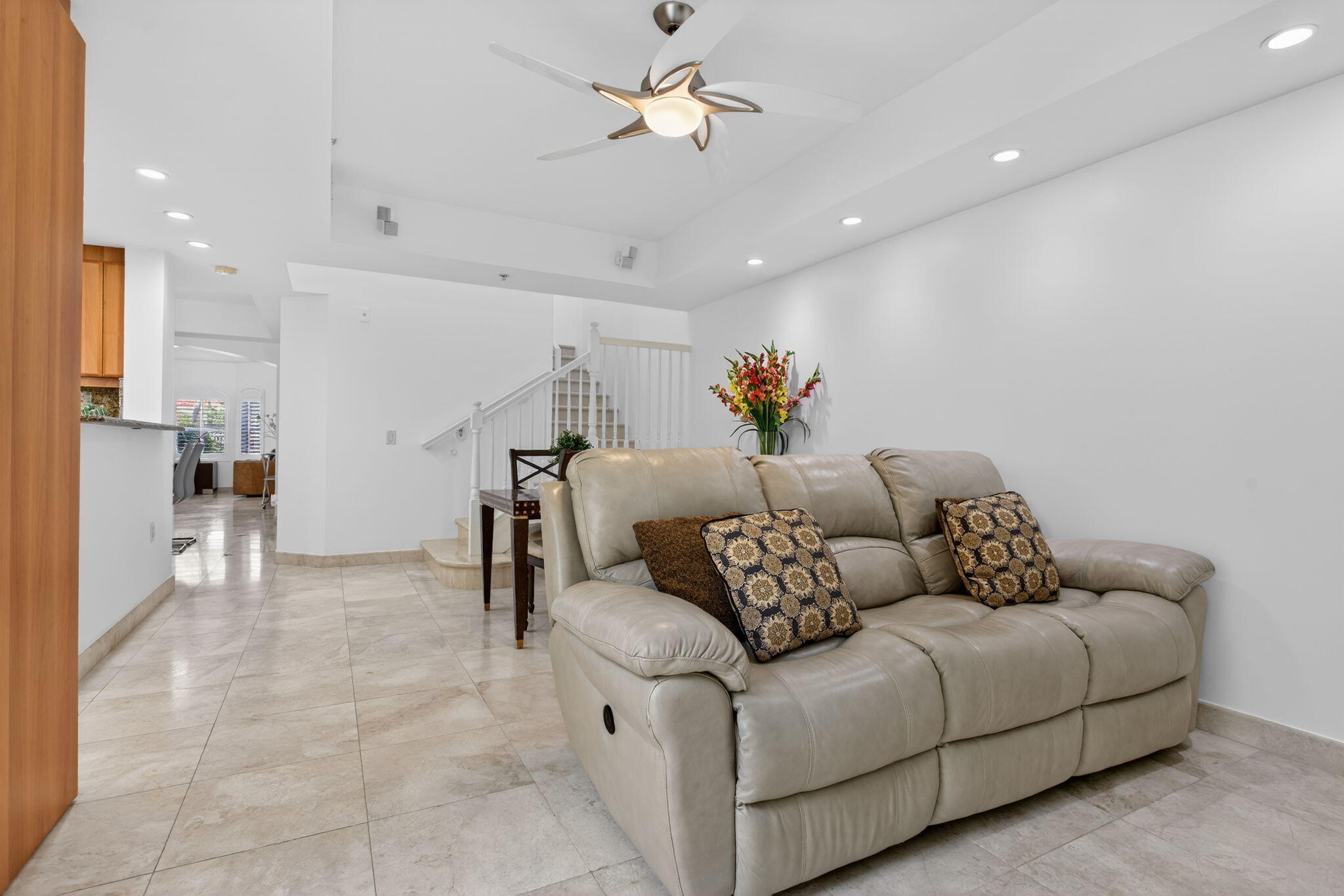 2051 Southeast 3rd Street, Unit TH8 Deerfield Beach, FL 33441 - Photo 23 of 58 a living room with furniture and a ceiling fan