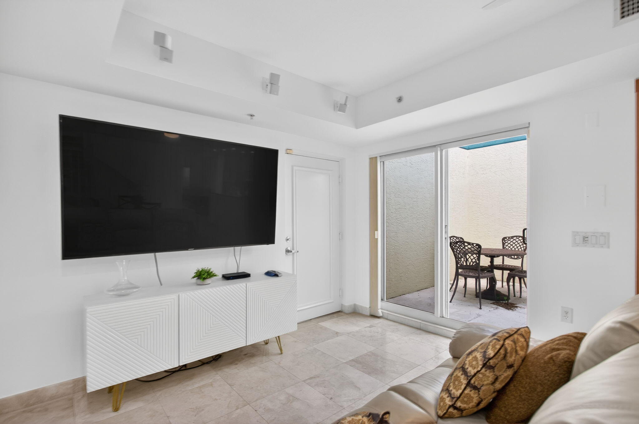 2051 Southeast 3rd Street, Unit TH8 Deerfield Beach, FL 33441 - Photo 25 of 58 a living room with furniture and a flat screen tv