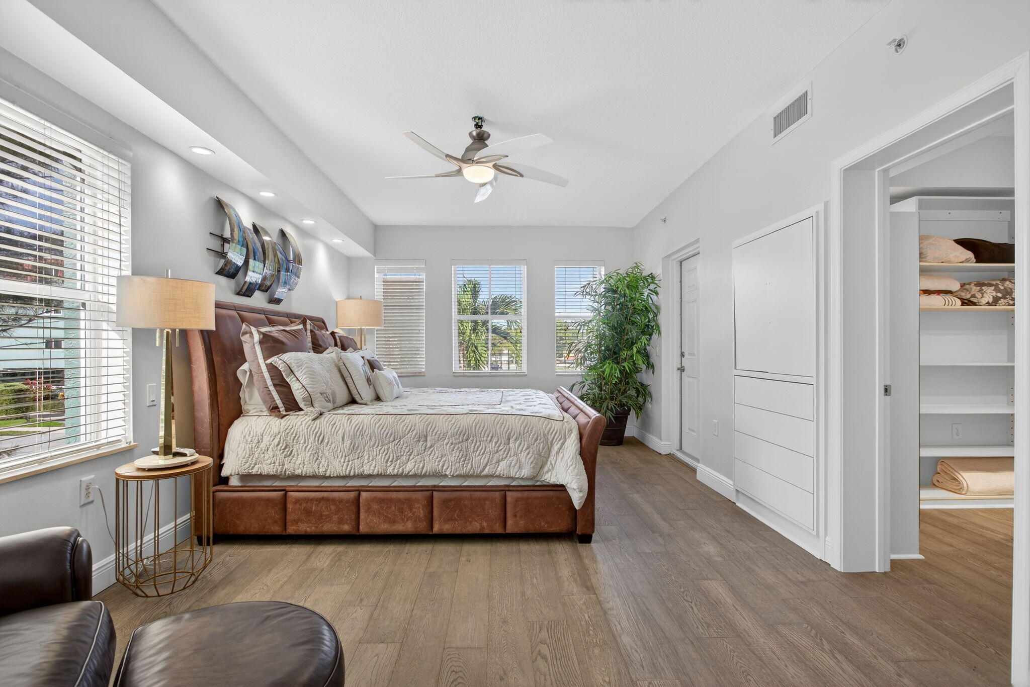 2051 Southeast 3rd Street, Unit TH8 Deerfield Beach, FL 33441 - Photo 26 of 58 a spacious bedroom with a bed a dresser and a large window