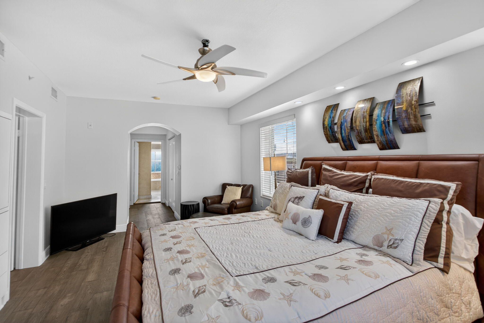 2051 Southeast 3rd Street, Unit TH8 Deerfield Beach, FL 33441 - Photo 27 of 58 a large bedroom with a bed and wooden floor