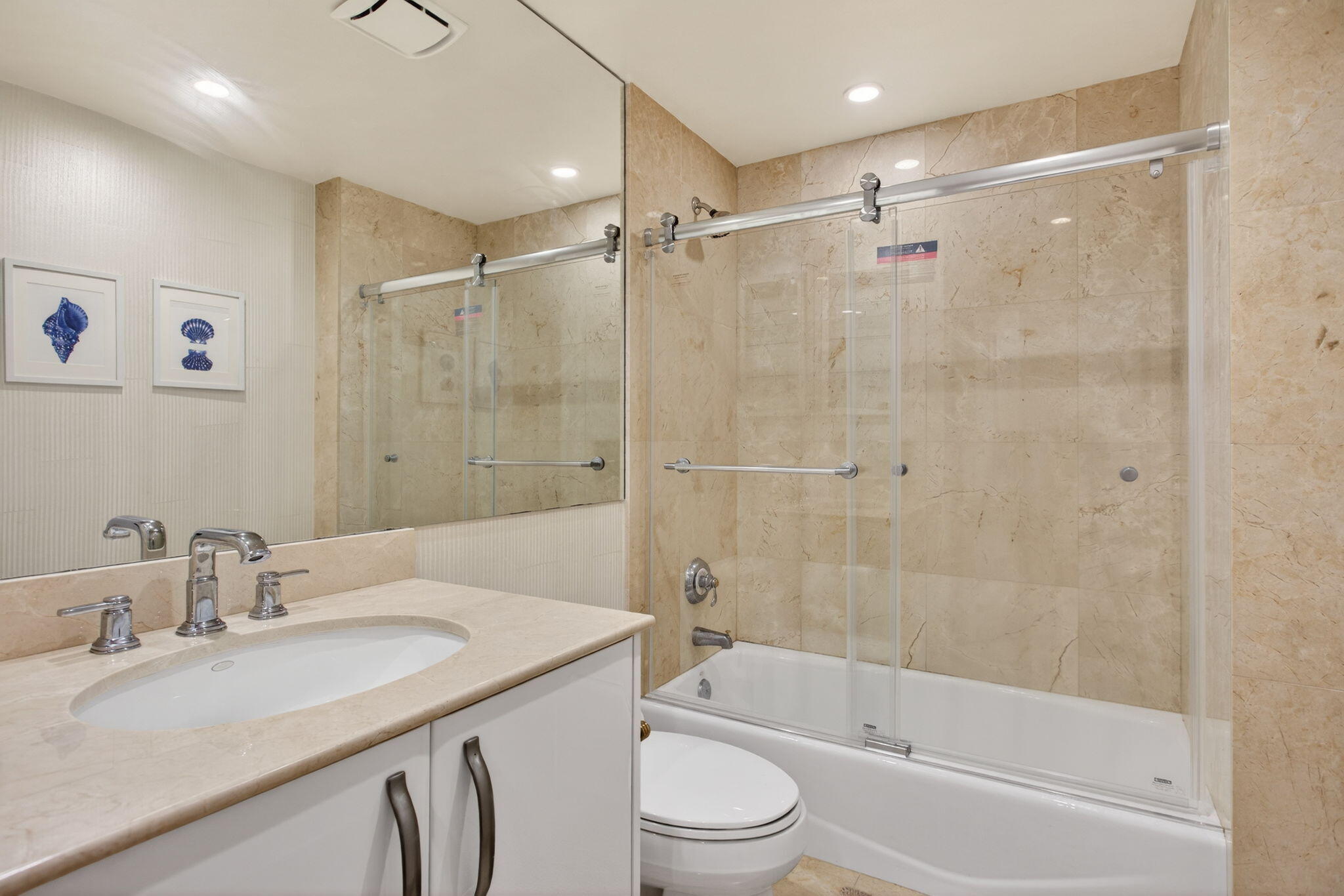 2051 Southeast 3rd Street, Unit TH8 Deerfield Beach, FL 33441 - Photo 39 of 58 a bathroom with a granite countertop sink toilet and shower