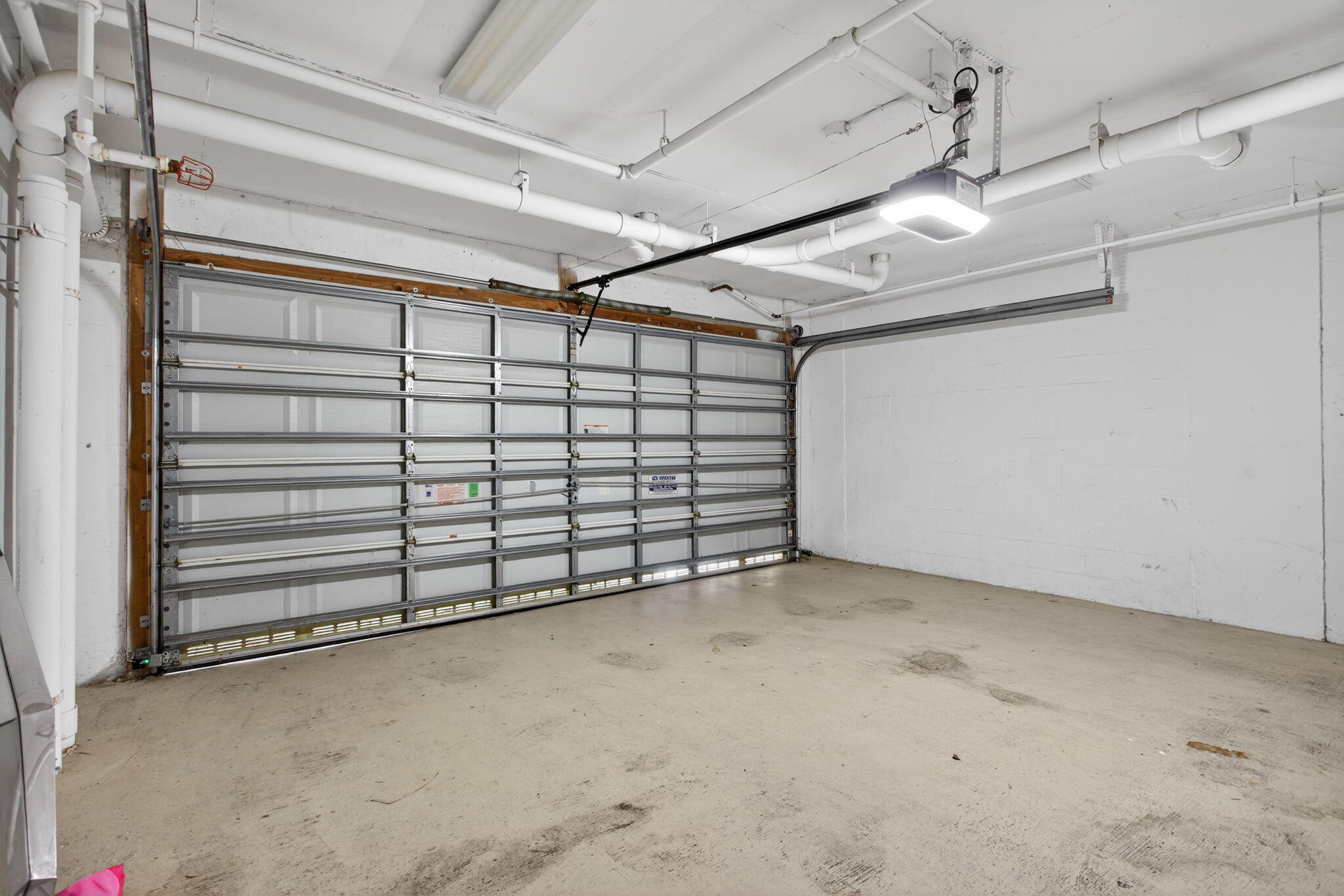 2051 Southeast 3rd Street, Unit TH8 Deerfield Beach, FL 33441 - Photo 40 of 58 a view of a garage