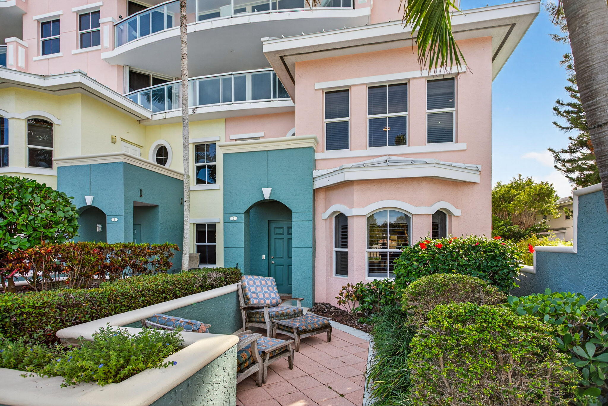 2051 Southeast 3rd Street, Unit TH8 Deerfield Beach, FL 33441 - Photo 5 of 58 a front view of a house with garden