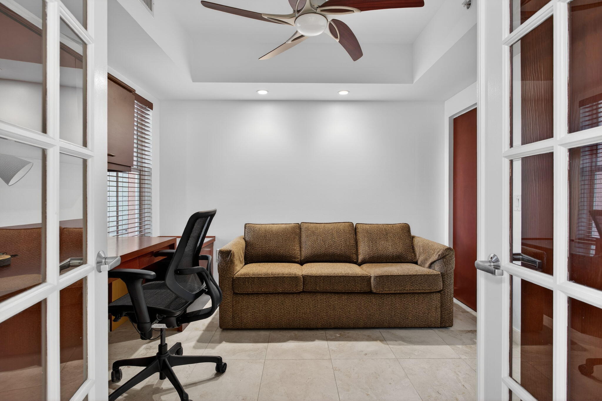 2051 Southeast 3rd Street, Unit TH8 Deerfield Beach, FL 33441 - Photo 10 of 58 a living room with furniture and a window