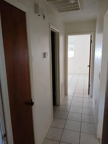 wooden floor with a bathroom