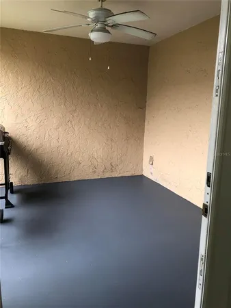 wooden floor in a hall with a window