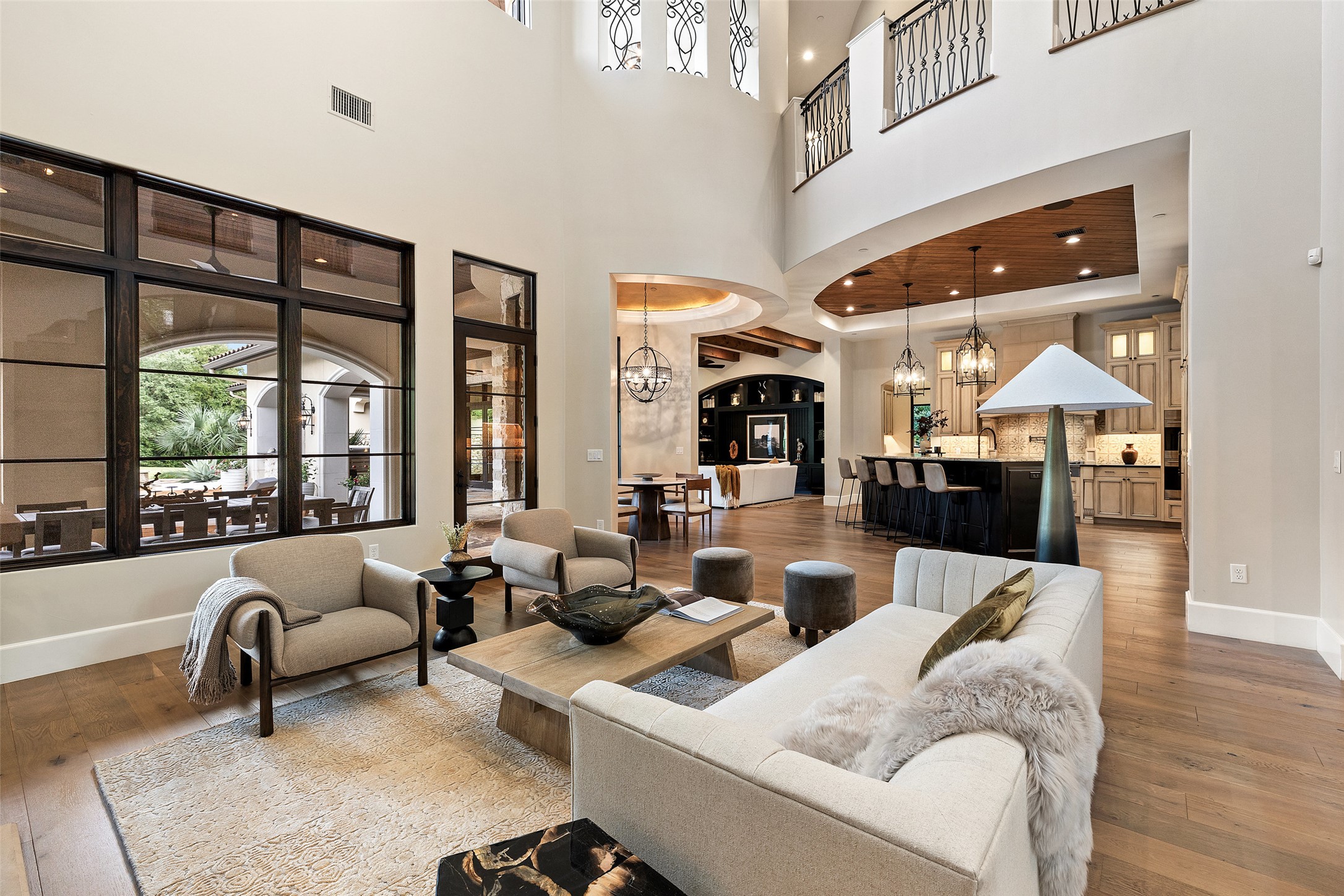 3667 Stoneridge Road Austin, TX 78746 - Photo 10 of 40 The home’s central spaces are arranged in an open composition, linking the living room, kitchen, and breakfast area through proportion and light.