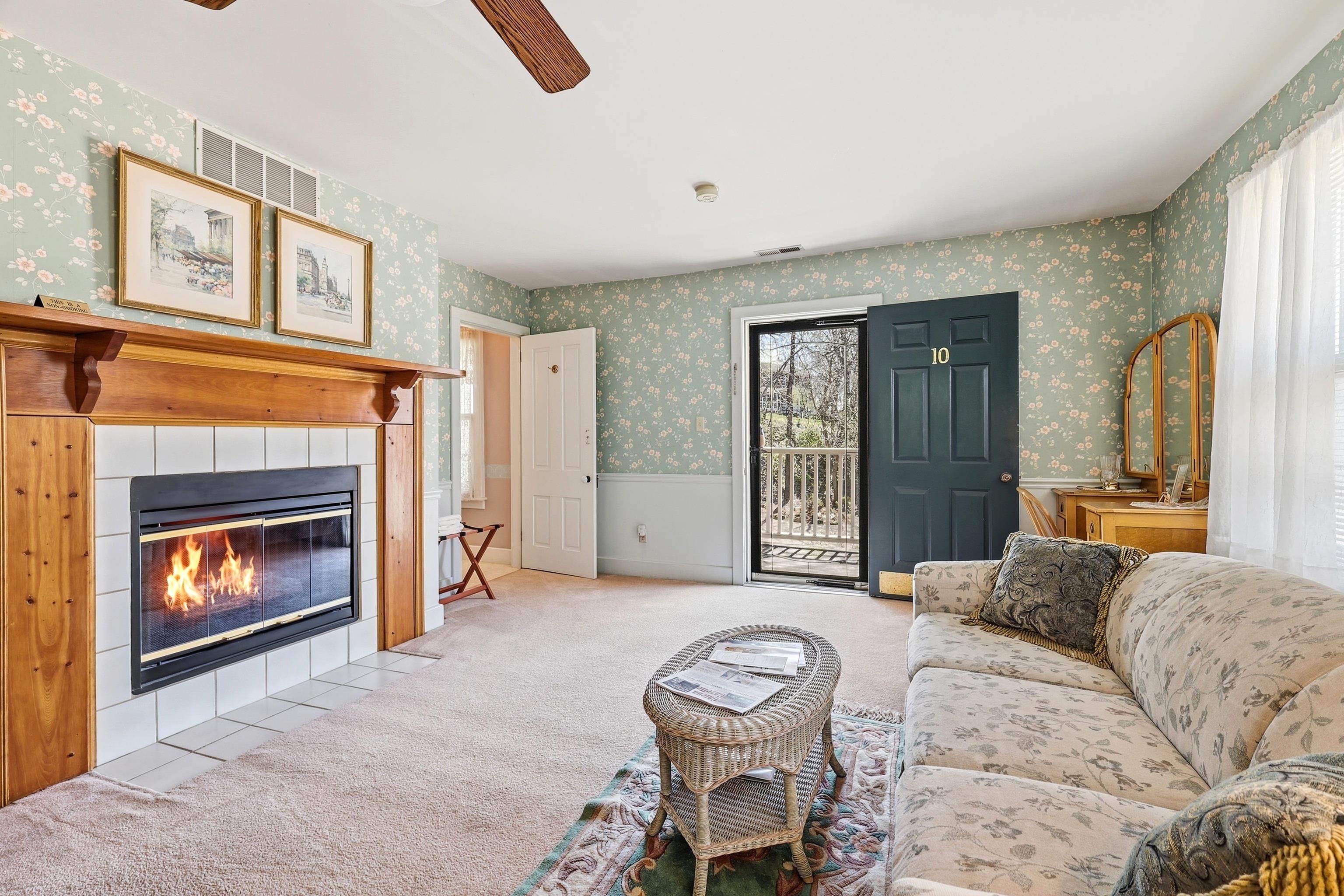 341 Spring Street Galena, IL 61036 - Photo 14 of 35 a living room with furniture a window and a fireplace
