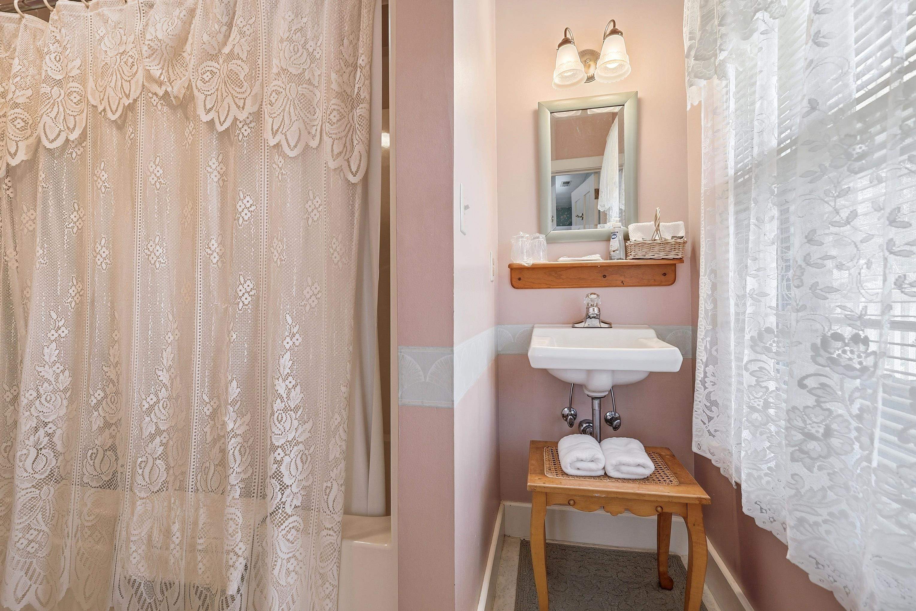 341 Spring Street Galena, IL 61036 - Photo 17 of 35 a bathroom with a sink a mirror and a toilet