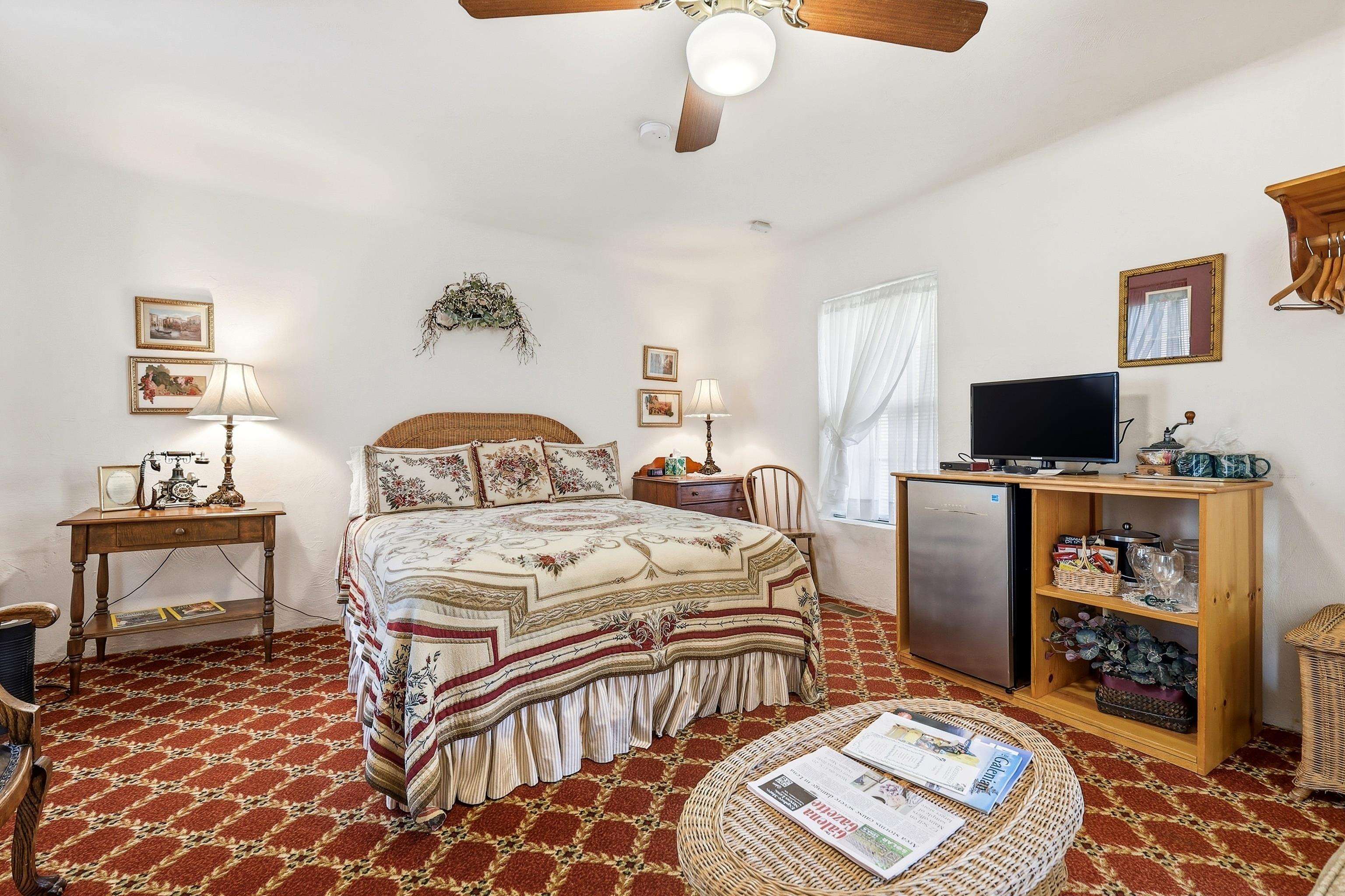 341 Spring Street Galena, IL 61036 - Photo 20 of 35 a bedroom with a bed and wooden floor