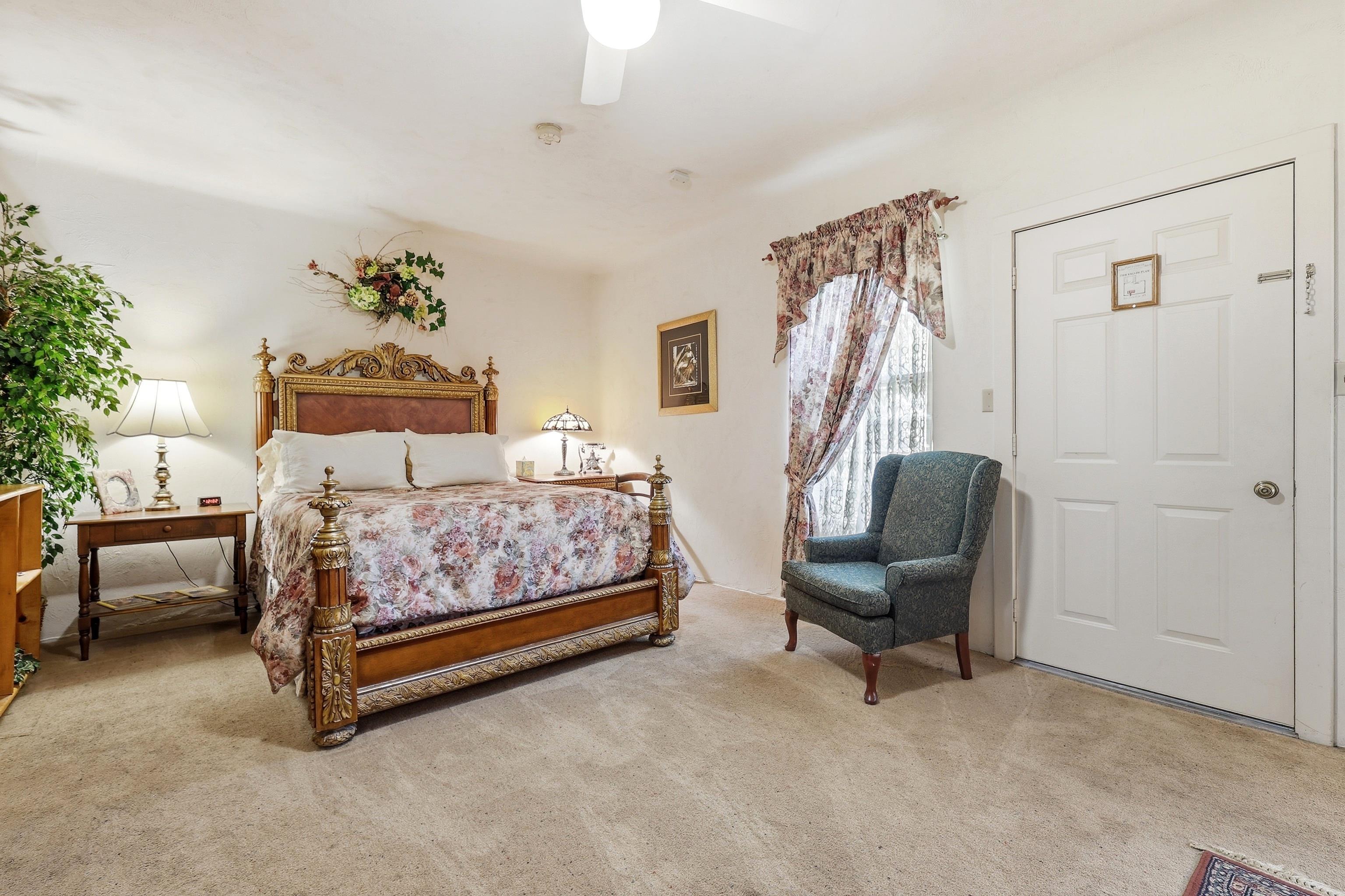 341 Spring Street Galena, IL 61036 - Photo 24 of 35 a bedroom with a bed and a chair