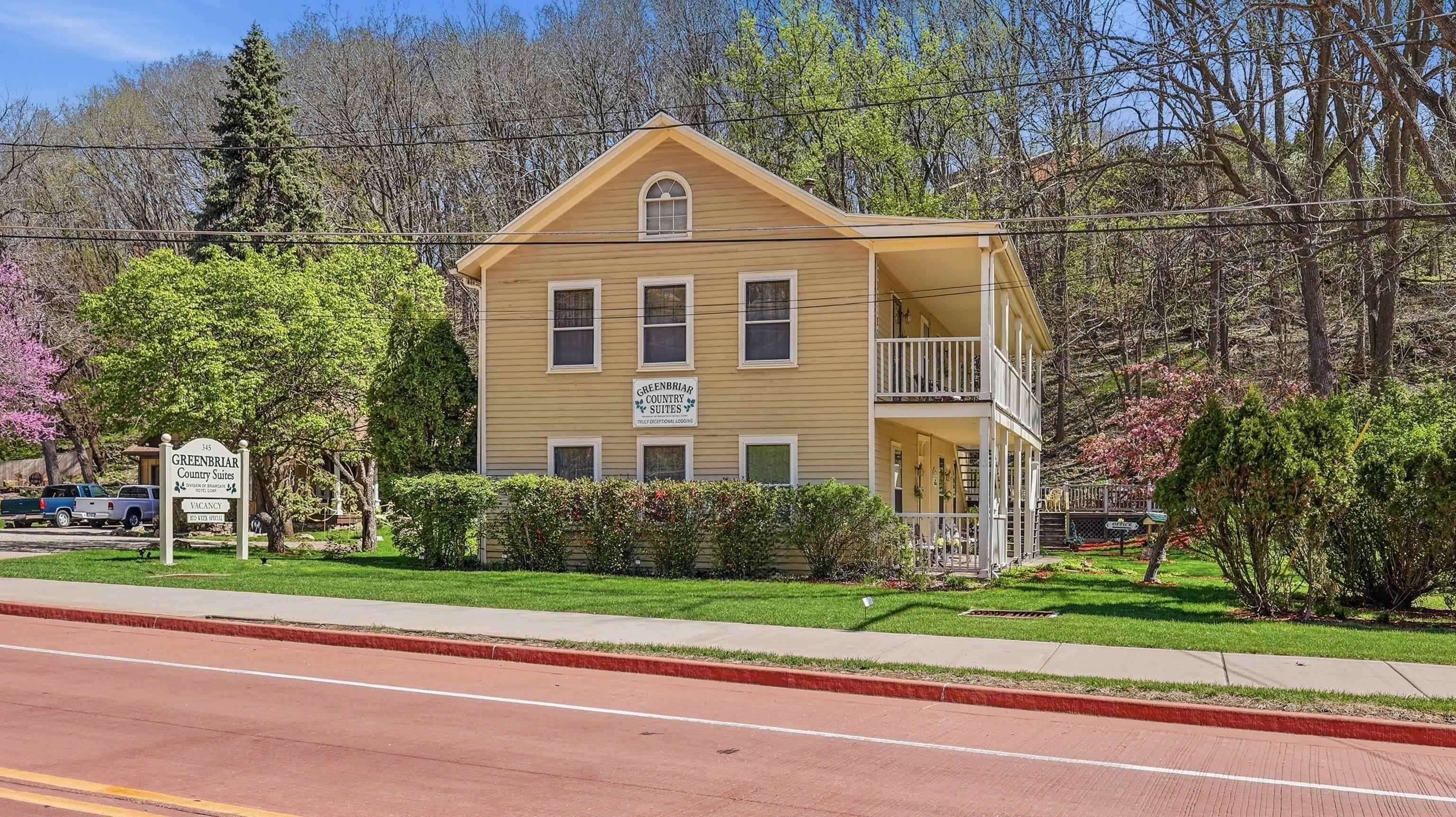 341 Spring Street Galena, IL 61036 - Photo 3 of 35 a front view of a house with a yard