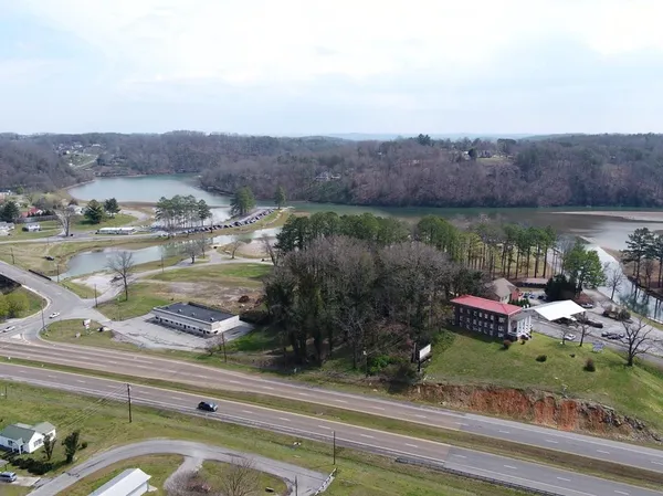 an aerial view of a house with a yard