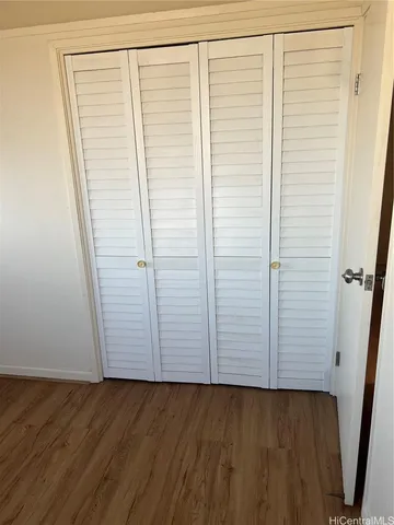 an empty room with wooden floor