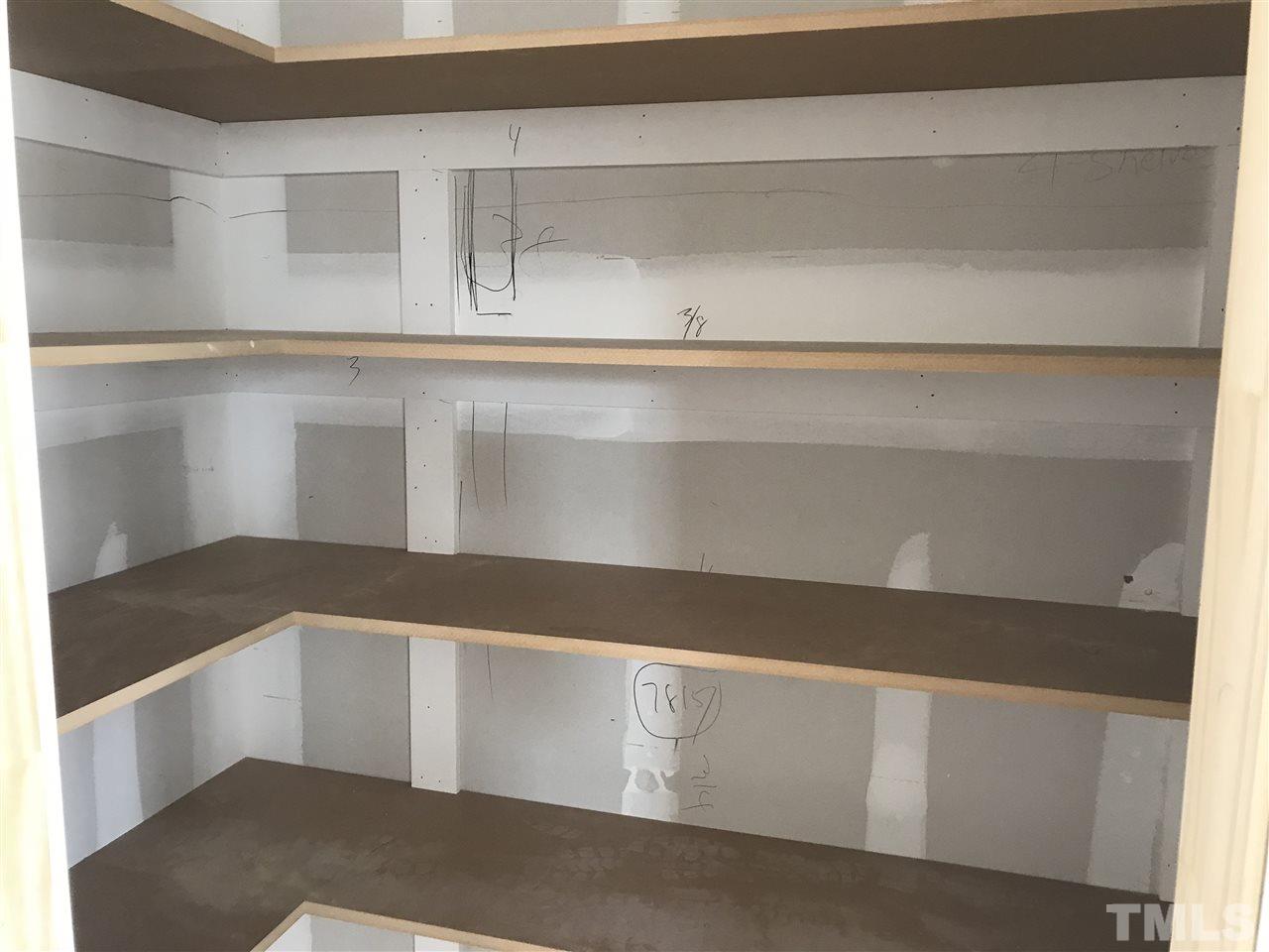 429 Slick Rock Road Wendell, NC 27591 - Photo 8 of 19 Enormous pantry with wood shelving.