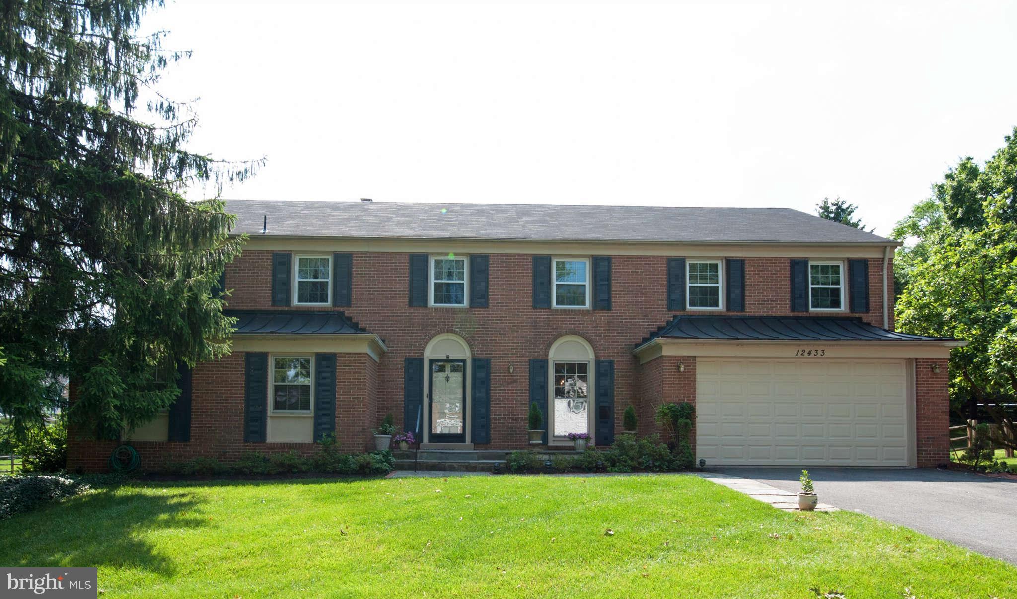 12433 Over Ridge Road Potomac, MD 20854 - Photo 1 of 30 a front view of house with yard and green space