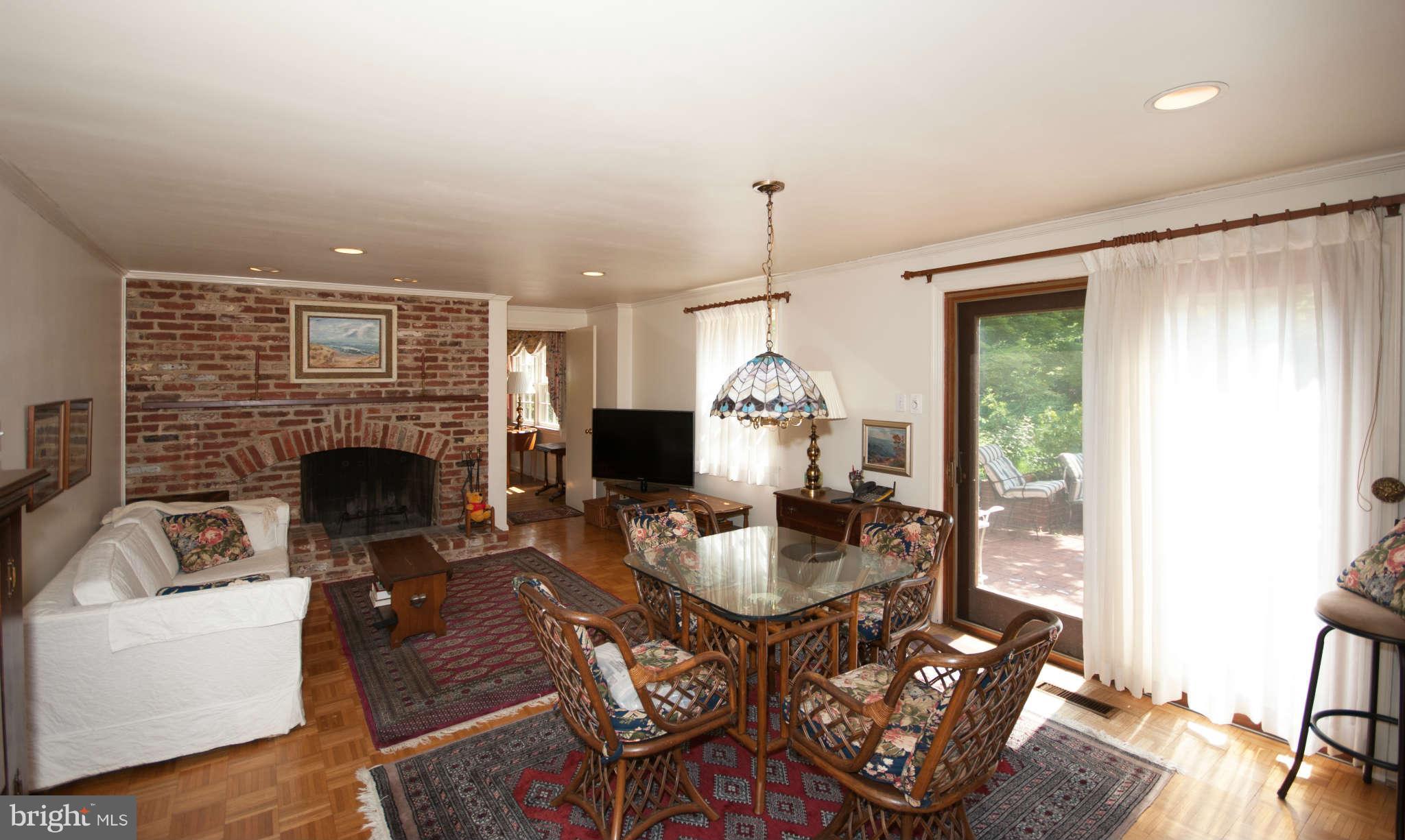 12433 Over Ridge Road Potomac, MD 20854 - Photo 13 of 30 a living room with furniture fireplace and a large window
