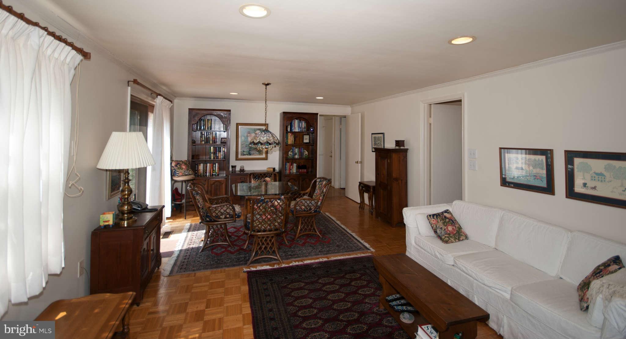 12433 Over Ridge Road Potomac, MD 20854 - Photo 15 of 30 a living room with furniture a dining table and a refrigerator