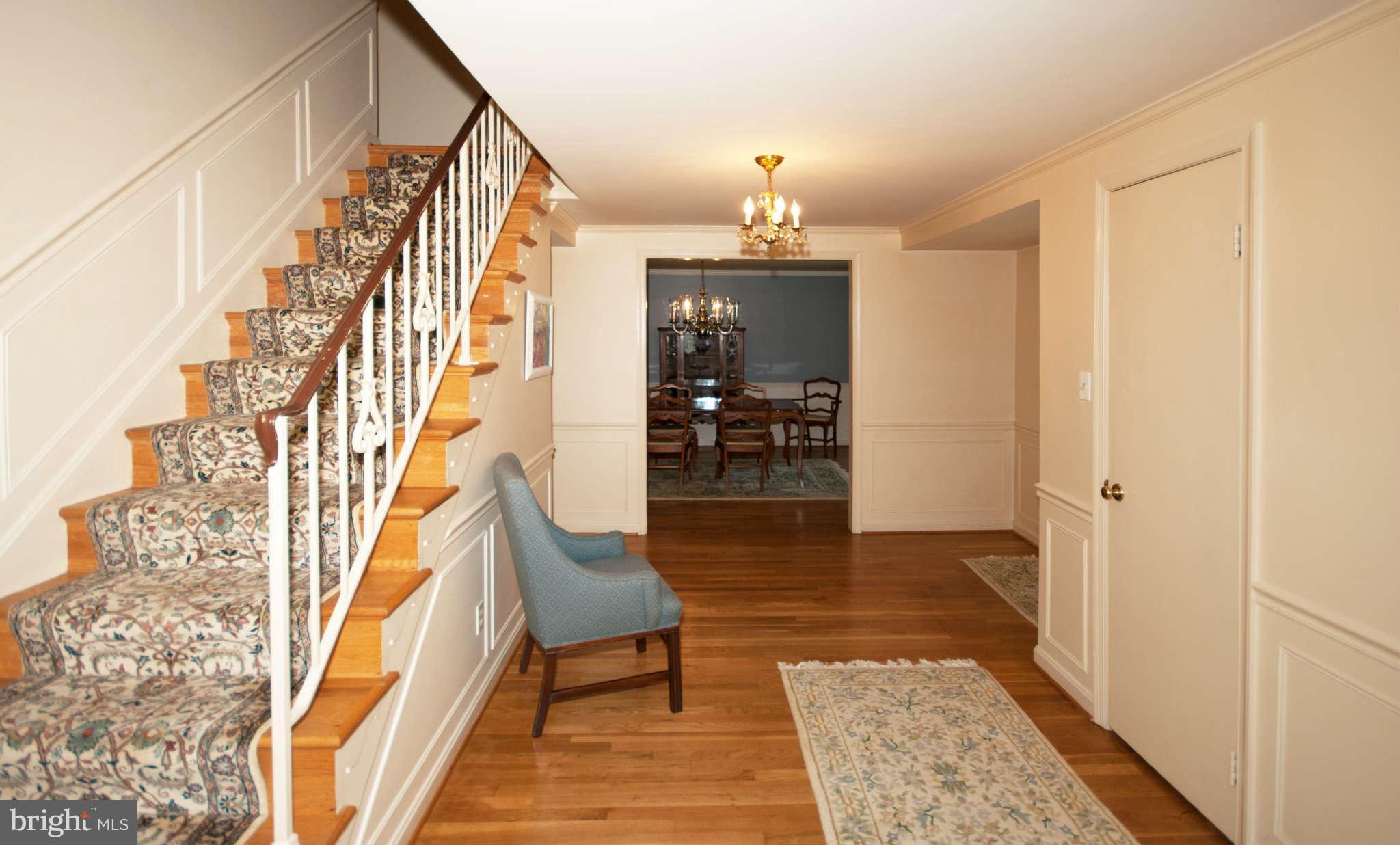 12433 Over Ridge Road Potomac, MD 20854 - Photo 17 of 30 a view of entryway dining room and hall with wooden floor