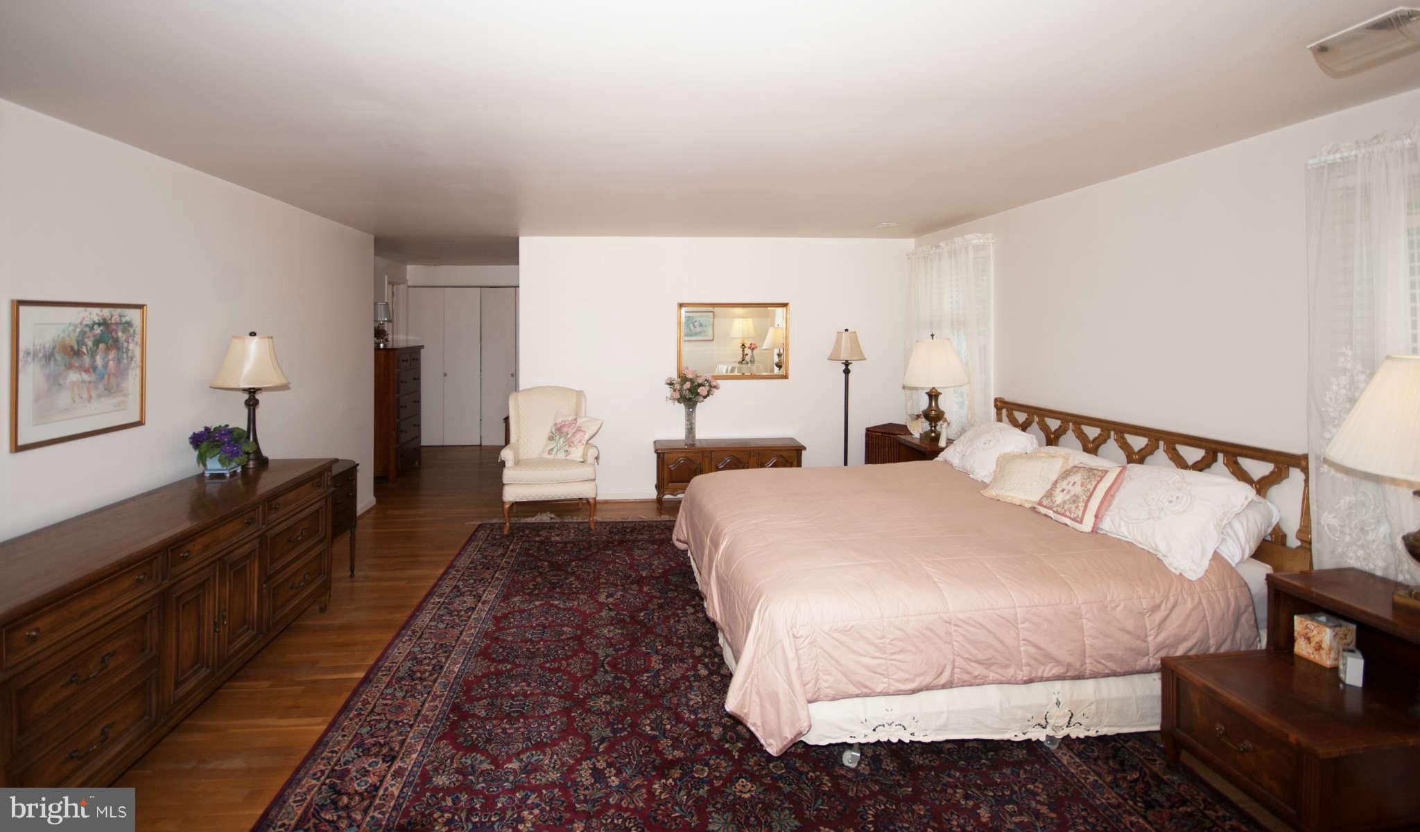 12433 Over Ridge Road Potomac, MD 20854 - Photo 18 of 30 a bed room with a bed and a lamp
