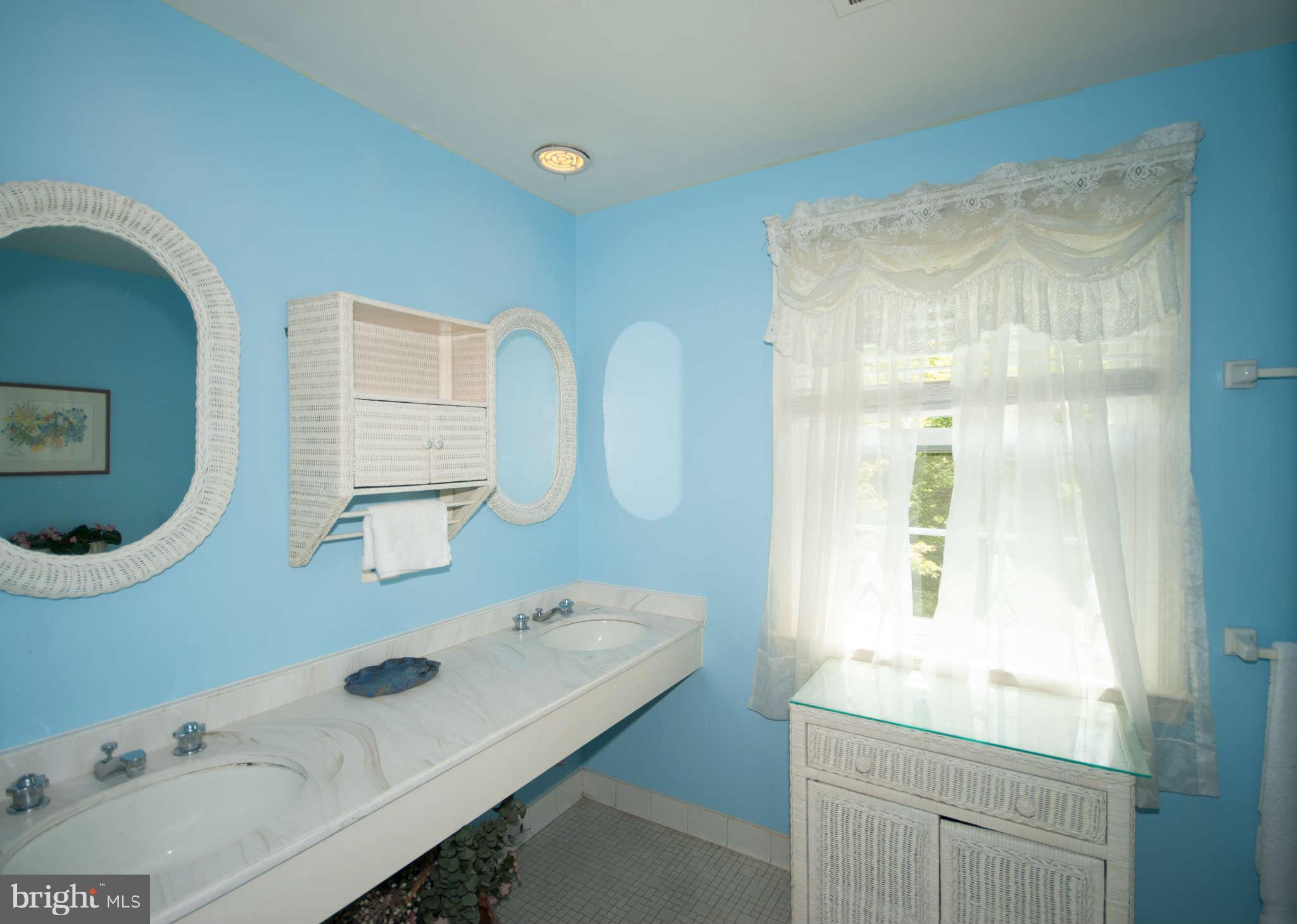 12433 Over Ridge Road Potomac, MD 20854 - Photo 25 of 30 a bathroom with a sink and a mirror