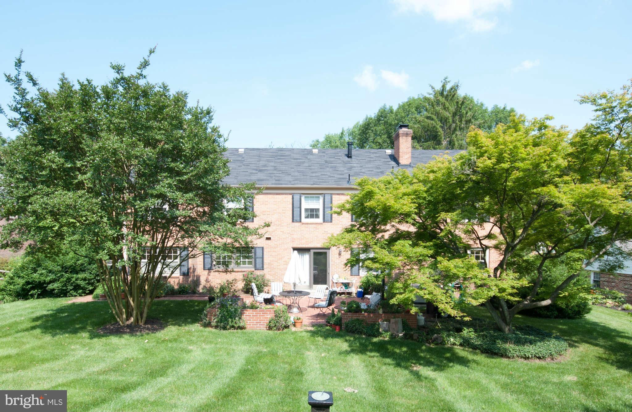 12433 Over Ridge Road Potomac, MD 20854 - Photo 26 of 30 a view of a house with a yard and sitting area