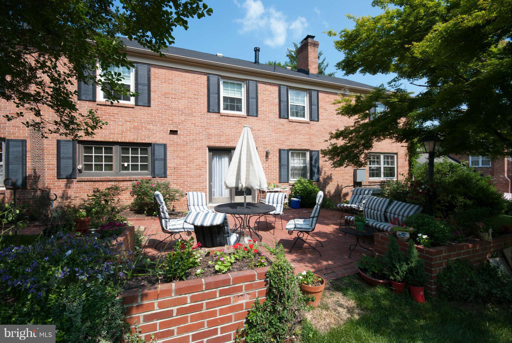 12433 Over Ridge Road Potomac, MD 20854 - Photo 29 of 30 a view of a house with backyard sitting area and garden