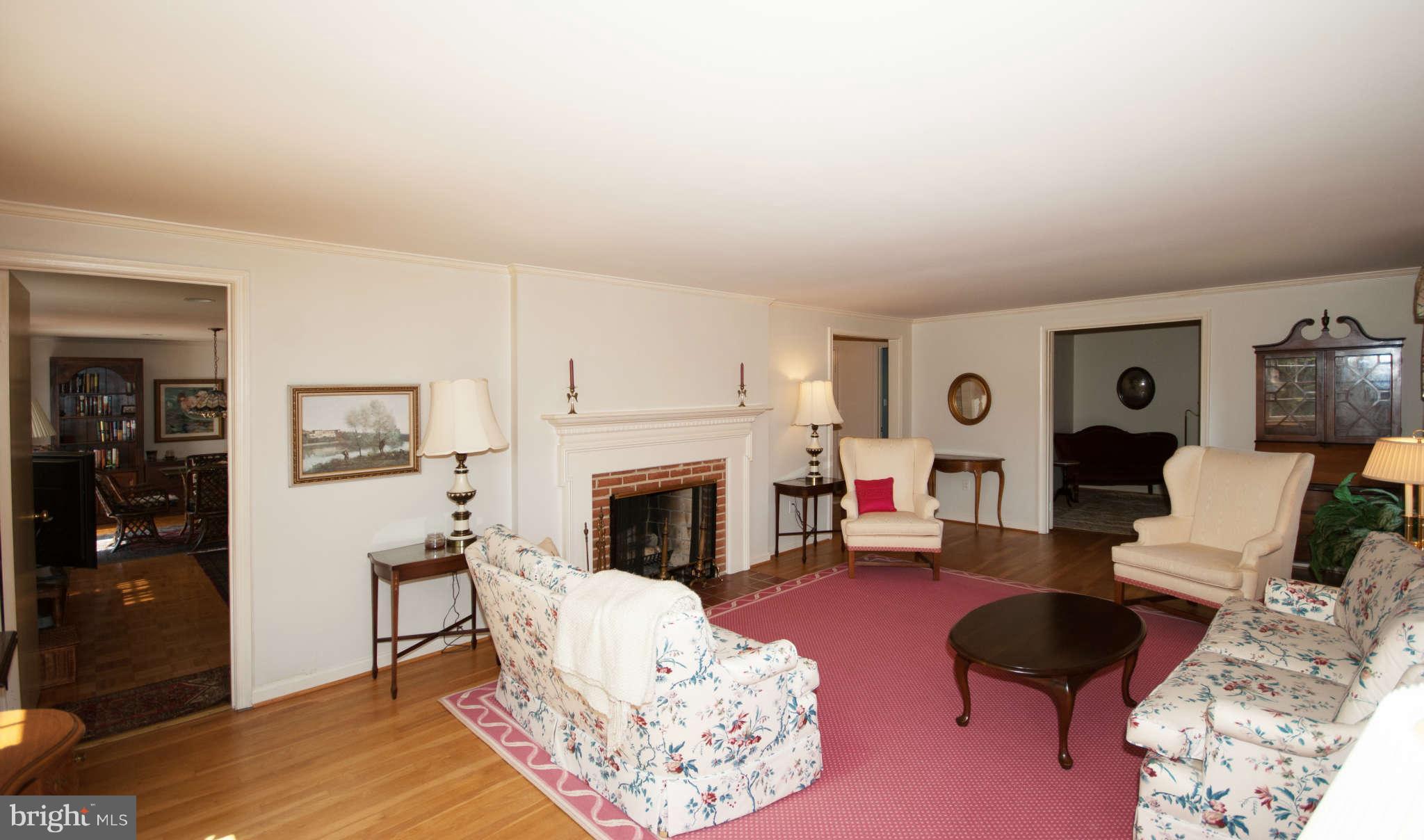 12433 Over Ridge Road Potomac, MD 20854 - Photo 4 of 30 a living room with furniture and a fireplace