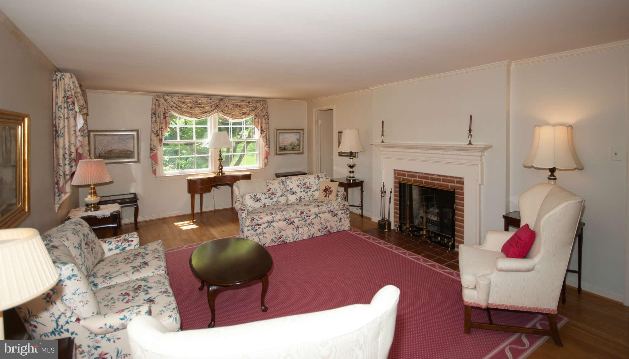 12433 Over Ridge Road Potomac, MD 20854 - Photo 5 of 30 a living room with furniture and a fireplace