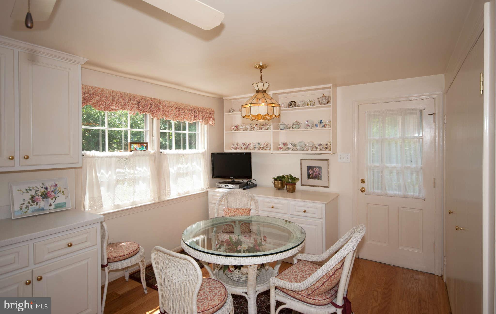 12433 Over Ridge Road Potomac, MD 20854 - Photo 10 of 30 a living room with furniture a fireplace and a large window