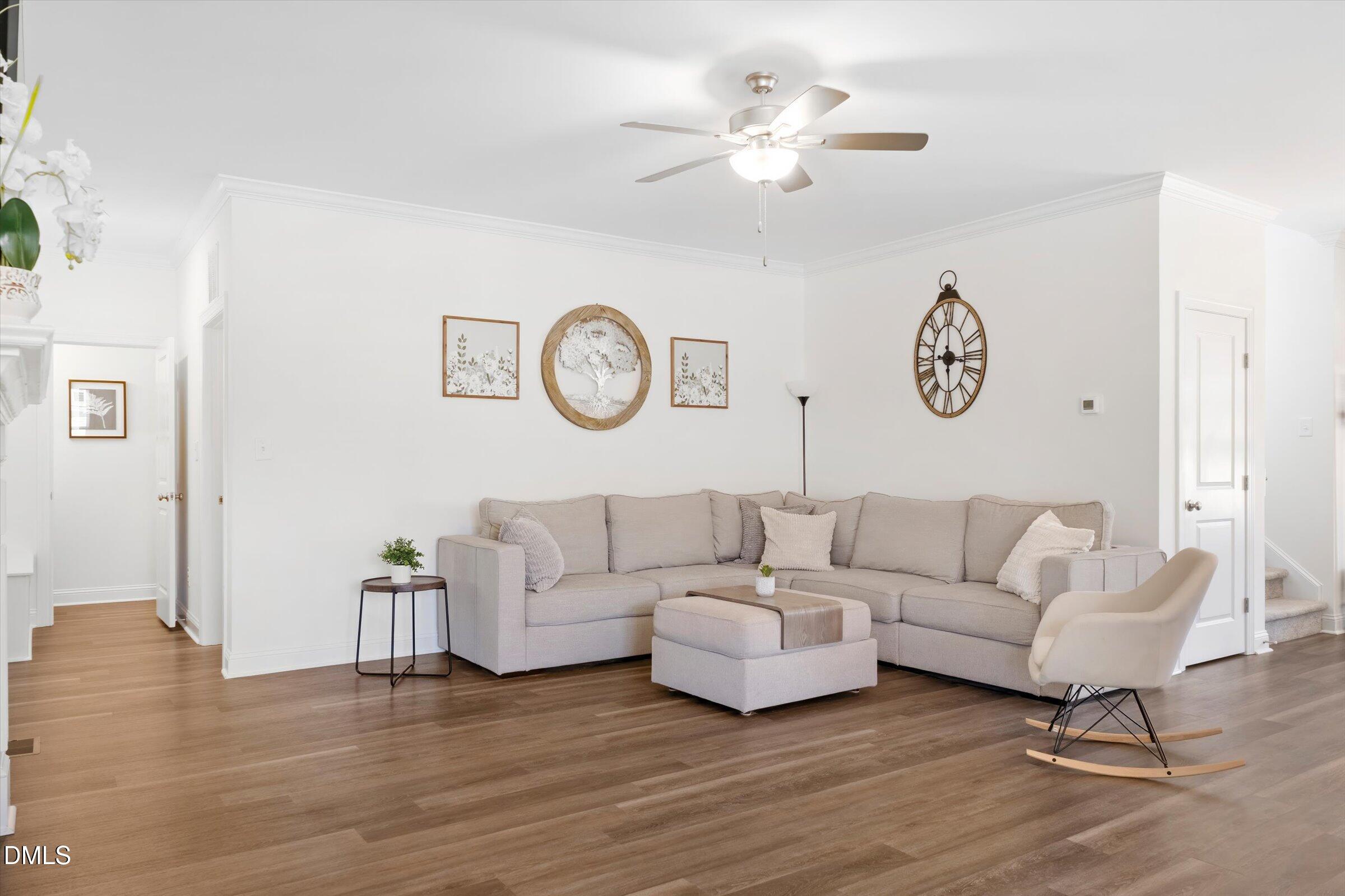 116 Nairn Street Fayetteville, NC 28311 - Photo 12 of 56 a living room with couches a coffee table and a clock