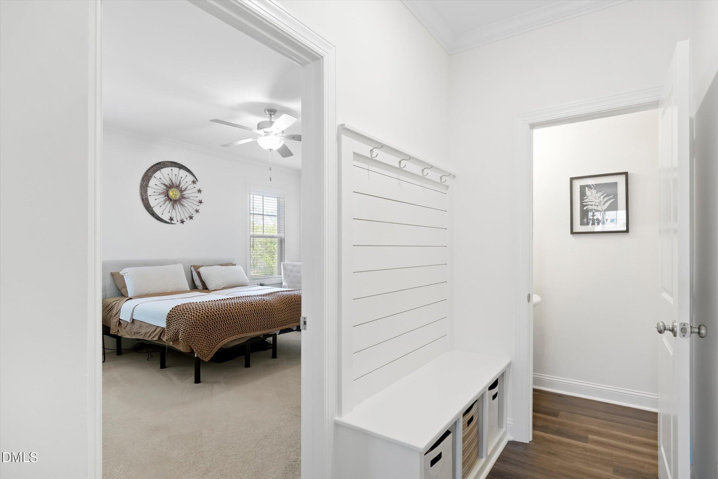 116 Nairn Street Fayetteville, NC 28311 - Photo 19 of 56 a bedroom with a bed and a chandelier