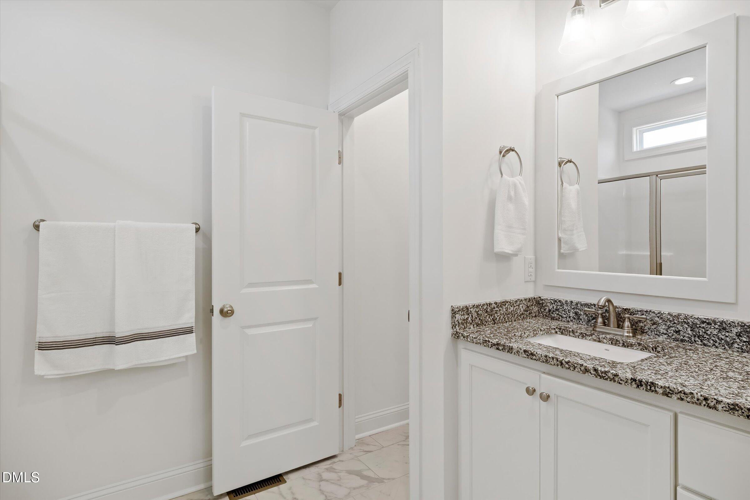 116 Nairn Street Fayetteville, NC 28311 - Photo 25 of 56 a bathroom with a granite countertop sink and a mirror