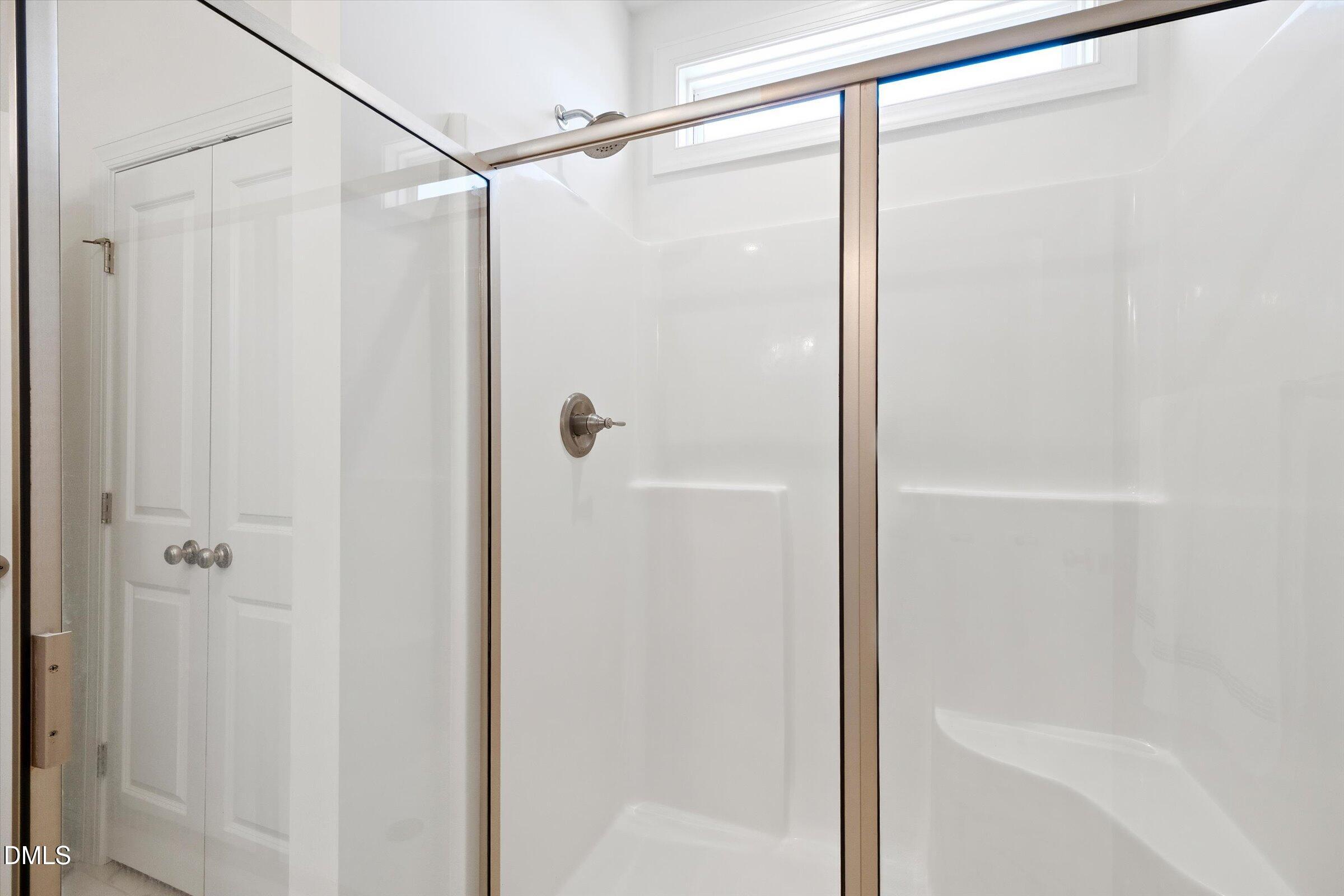 116 Nairn Street Fayetteville, NC 28311 - Photo 27 of 56 a bathroom with a glass shower door