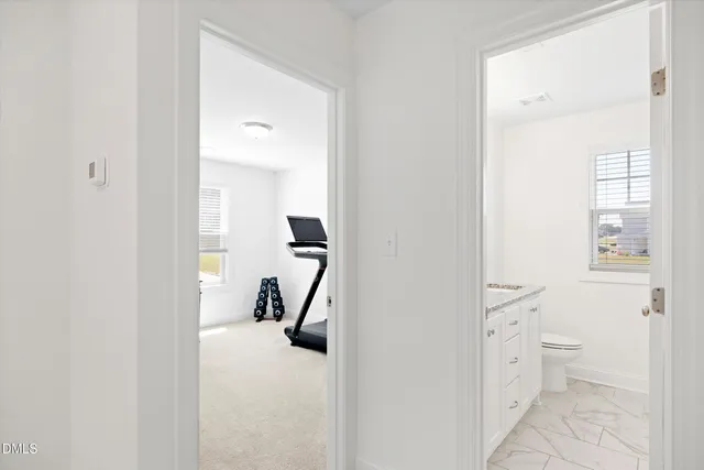 a view of a bathroom with mirror