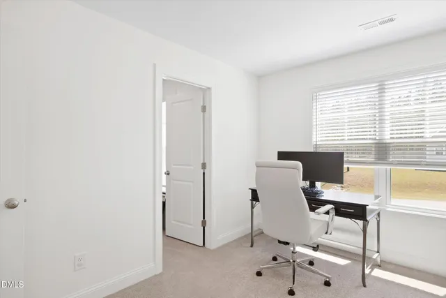 a view of room with furniture and wooden floor