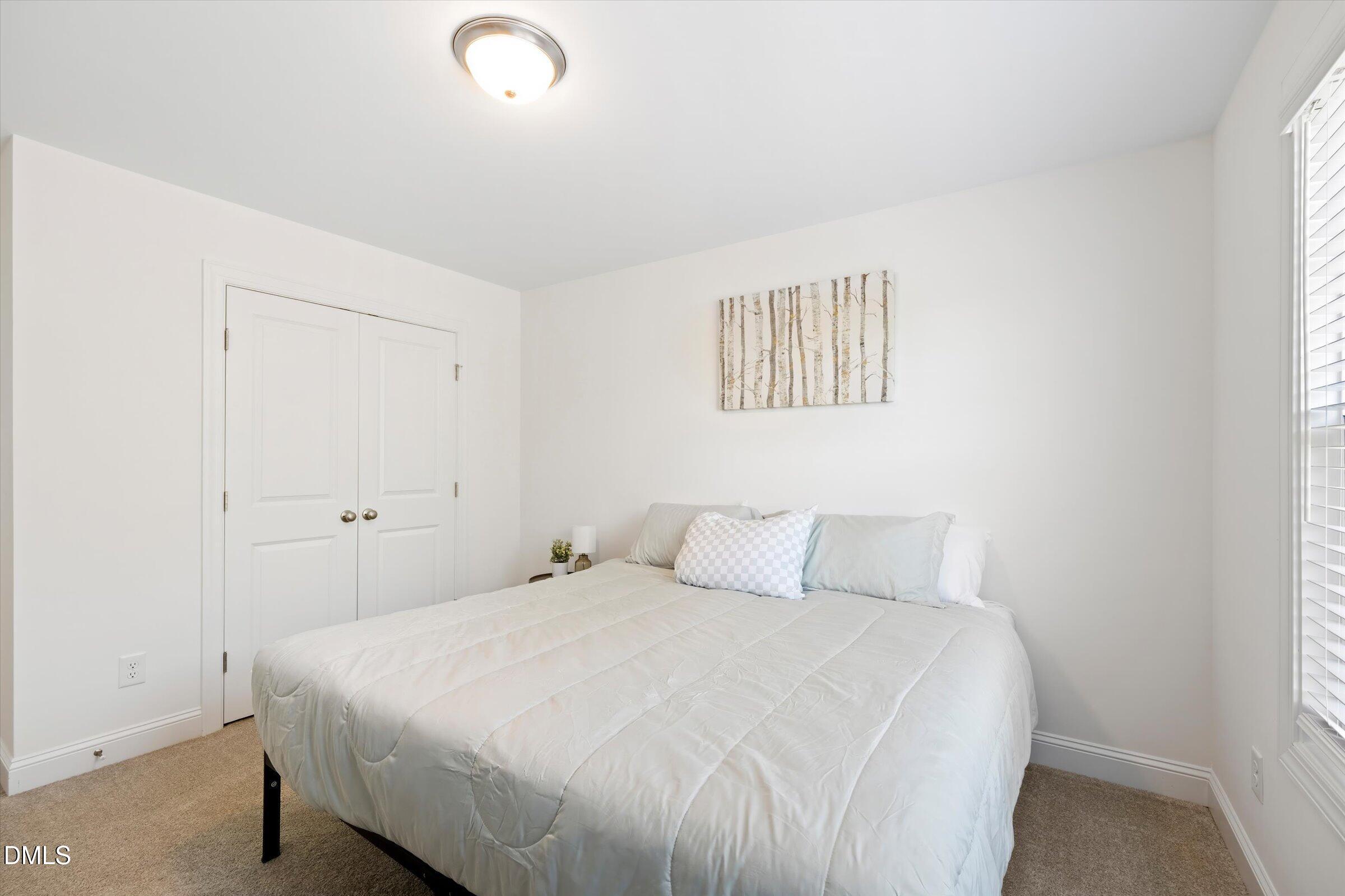 116 Nairn Street Fayetteville, NC 28311 - Photo 37 of 56 a bedroom with a bed and a window