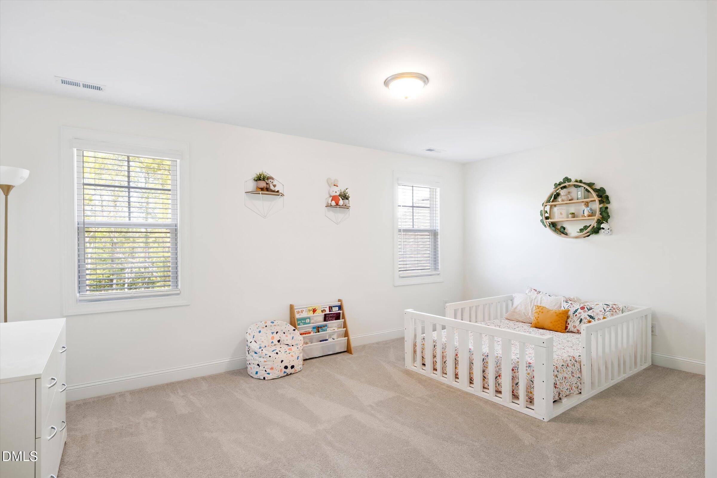 116 Nairn Street Fayetteville, NC 28311 - Photo 38 of 56 a bedroom with a bed and a window