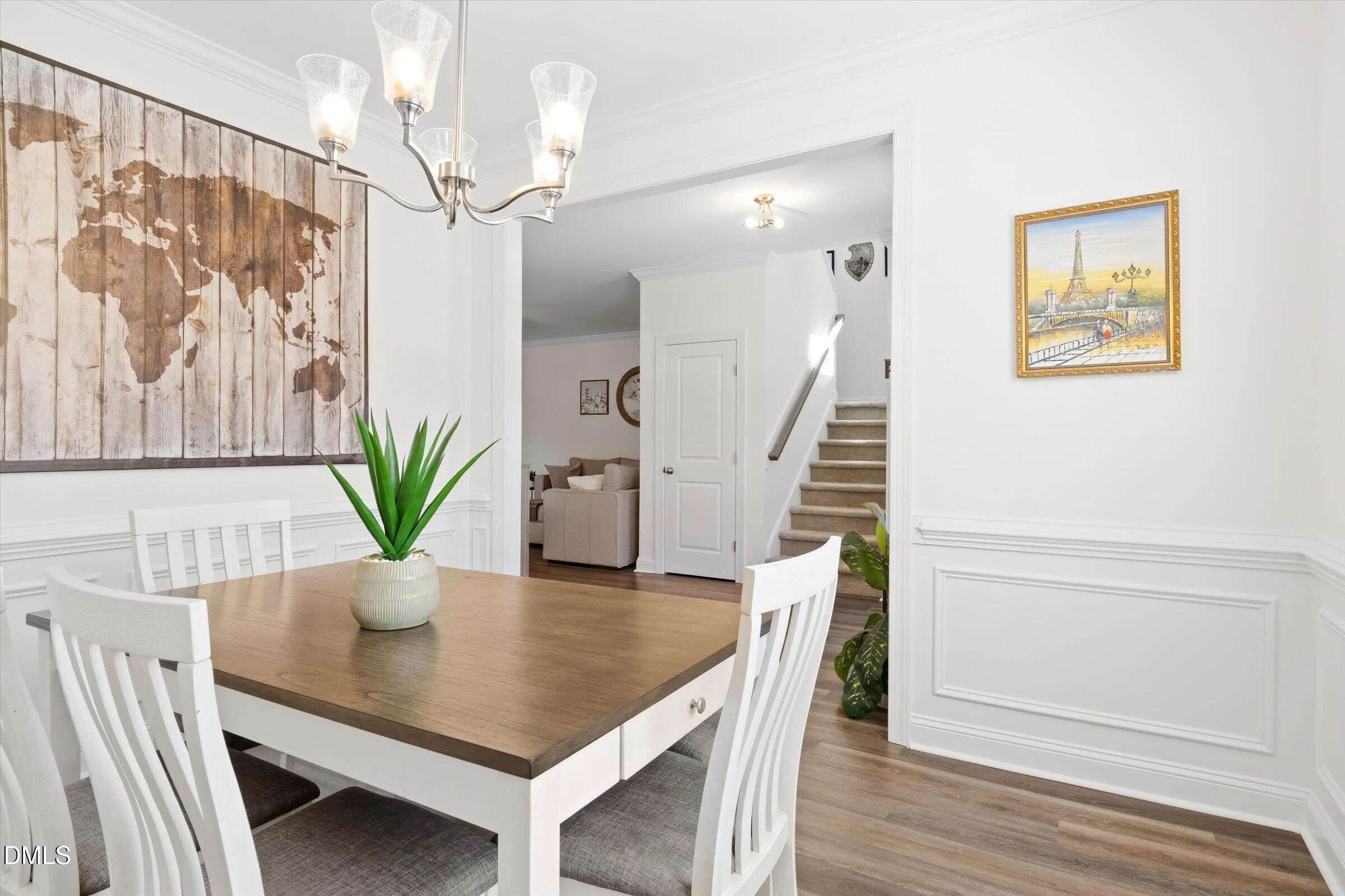 116 Nairn Street Fayetteville, NC 28311 - Photo 8 of 56 a view of a dining room with furniture and wooden floor