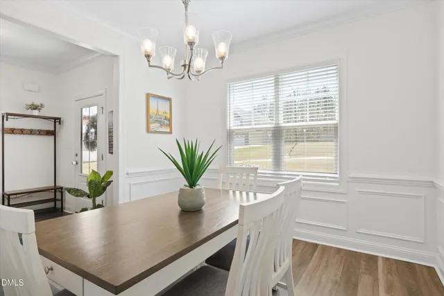 a view of a dining room with furniture and window