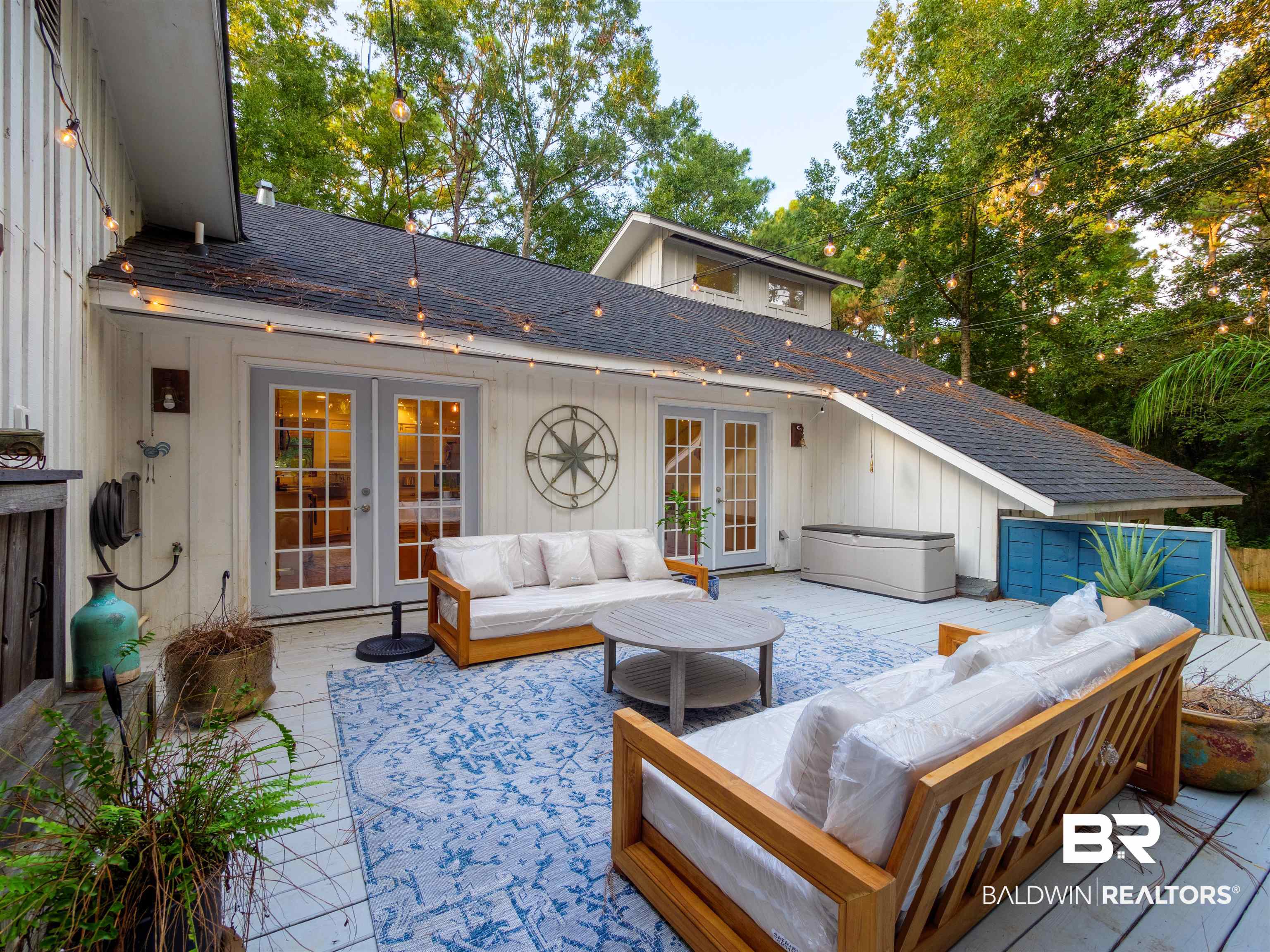 494 Ridgewood Drive Daphne, AL 36526 - Photo 32 of 40 Wooden terrace with a patio, french doors, and an outdoor living space
