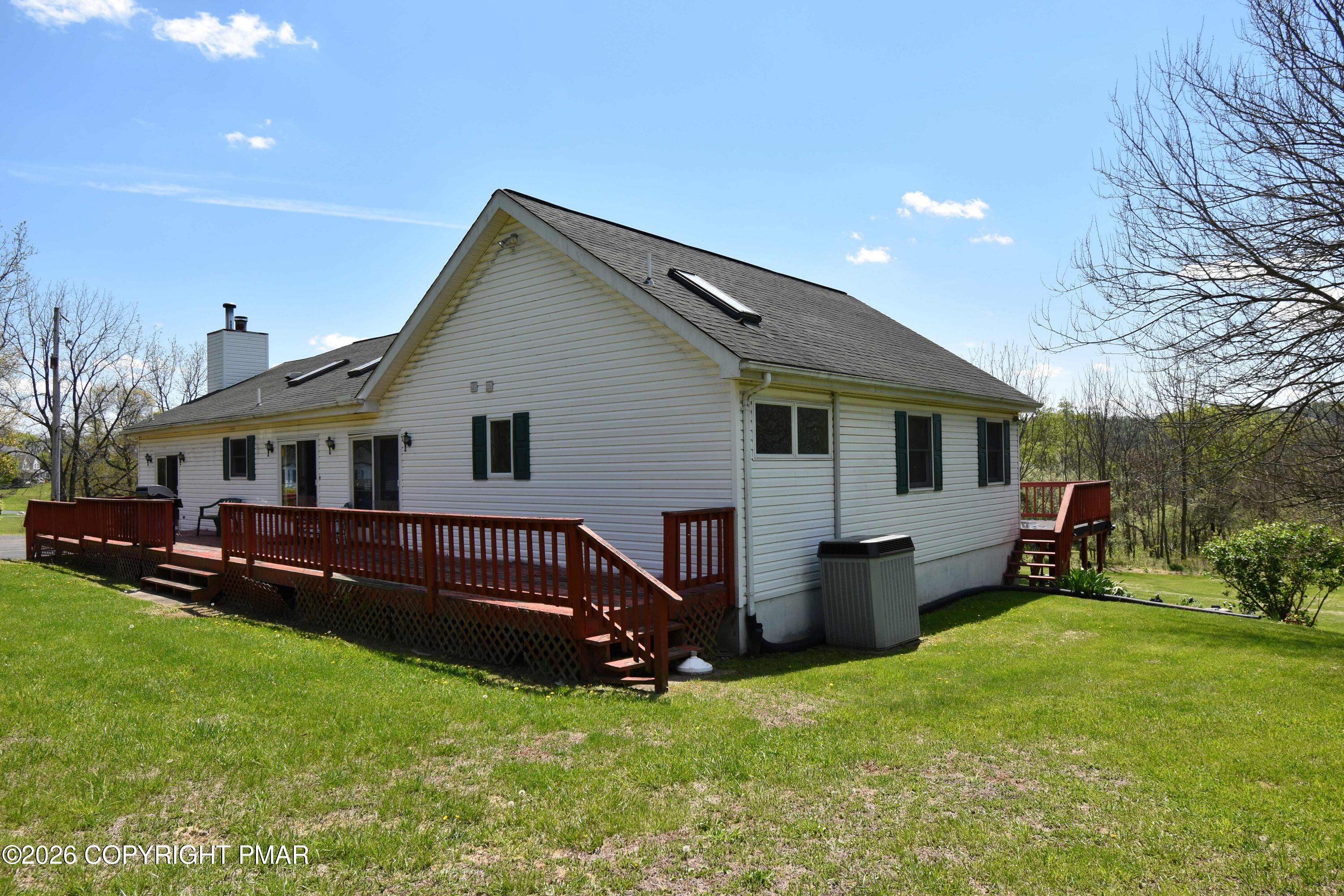 160 Quiet Valley Road Mount Bethel, PA 18343 - Photo 2 of 44 a view of a house with a yard chairs and a table