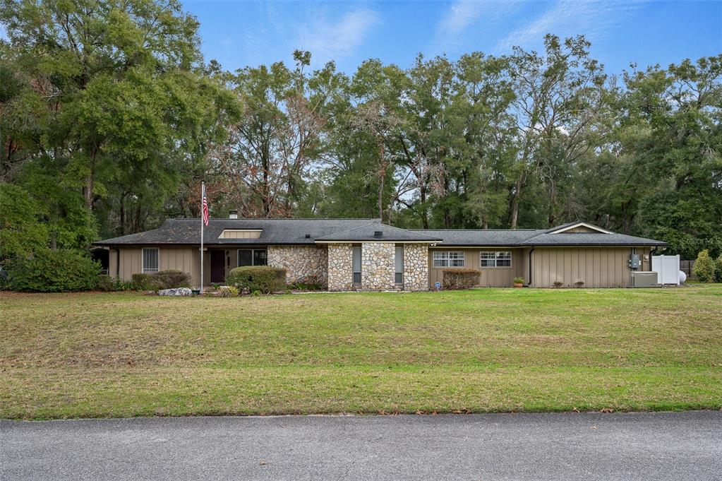 10804 Southwest 92 Place Gainesville, FL 32608 - Photo 1 of 1 front view of a house with a yard
