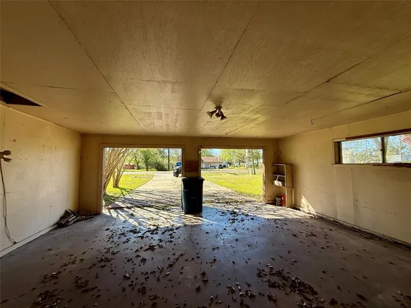a view of a room with window & chandelier