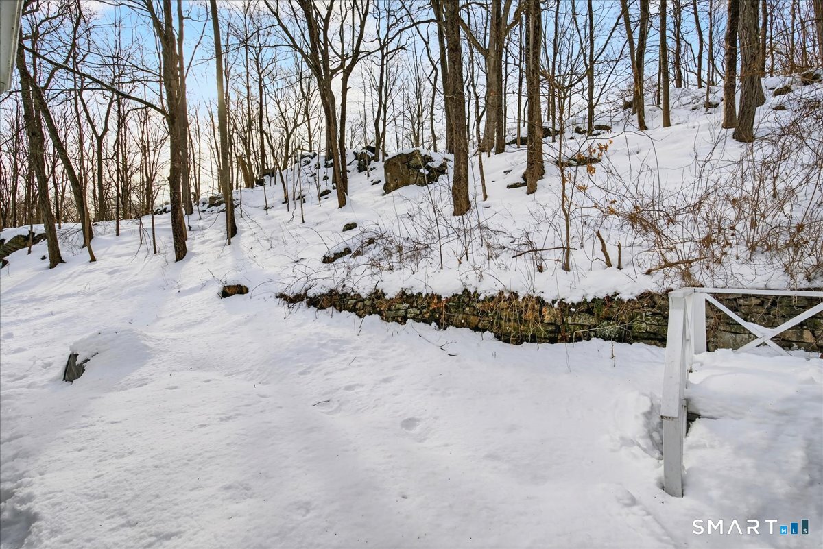 31 Longview Drive Ridgefield, CT 06877 - Photo 11 of 39 a view of snow on the road